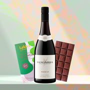 Gift arrangement displaying a bottle of red wine, a box of single-origin Ugandan organic chocolate, and a segmented dark chocolate ba